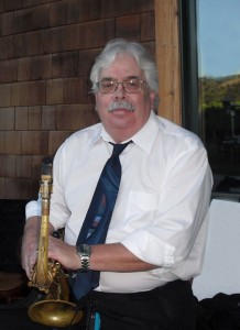 Alastair Ingram holding his saxophone.